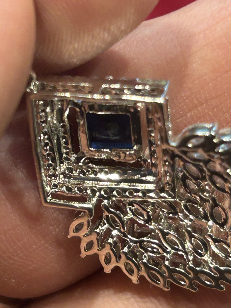 Sapphire Bloom Pendant — hallmark close-up