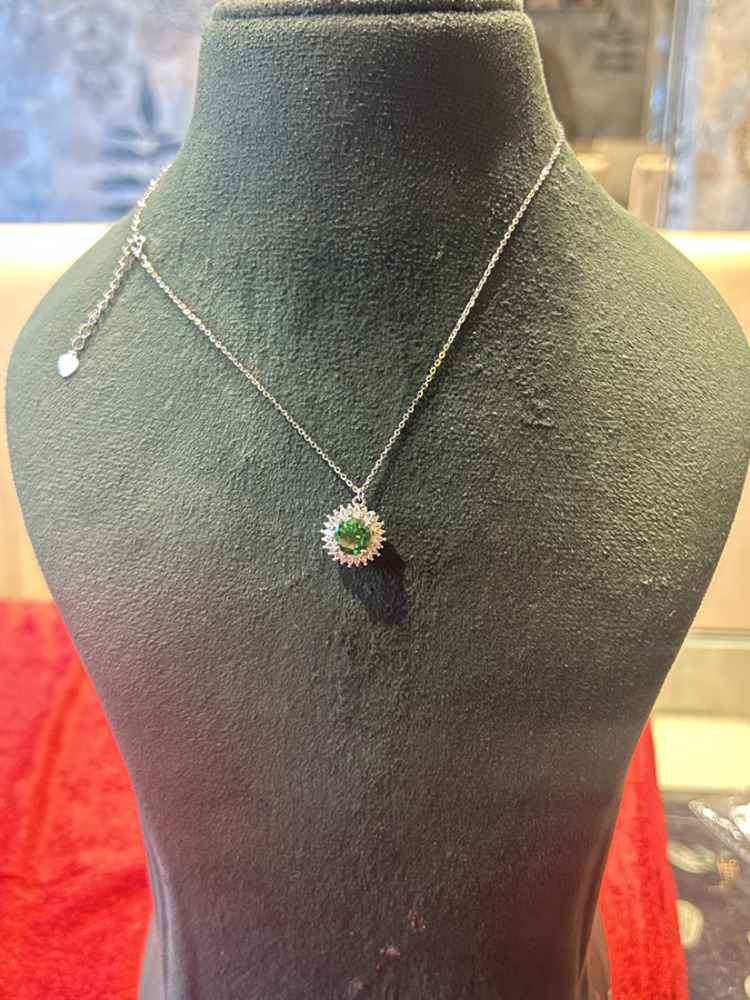 Emerald Sunburst Necklace — worn view